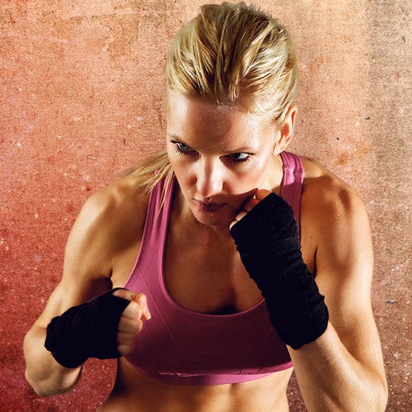 Mixed Martial Arts Lessons for Adults in Dothan AL - Lady Kickboxing Focused Background