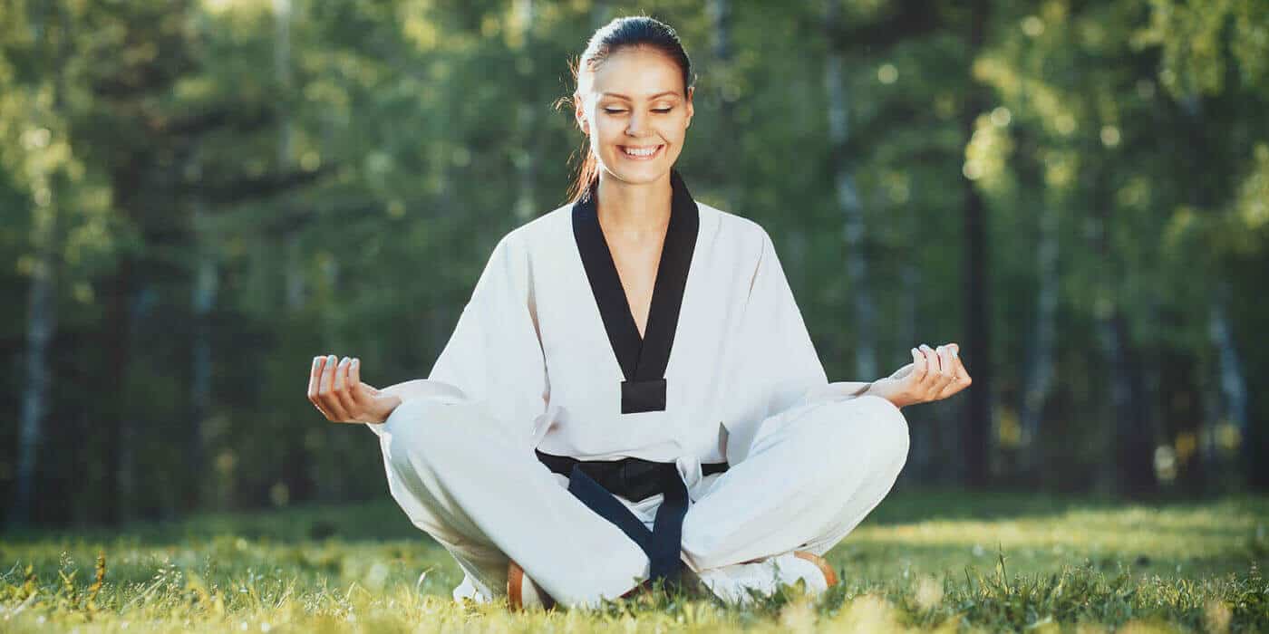 Martial Arts Lessons for Adults in Dothan AL - Happy Woman Meditated Sitting Background